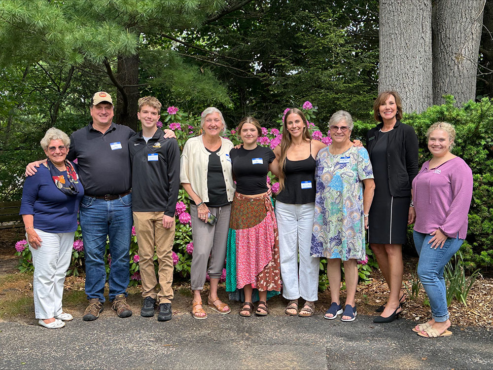 MEA_Retired_Scholarship_Recipeints_MB_Kyley-(1) Group of scholarship recipients and MEA Retired members posing together outdoors.