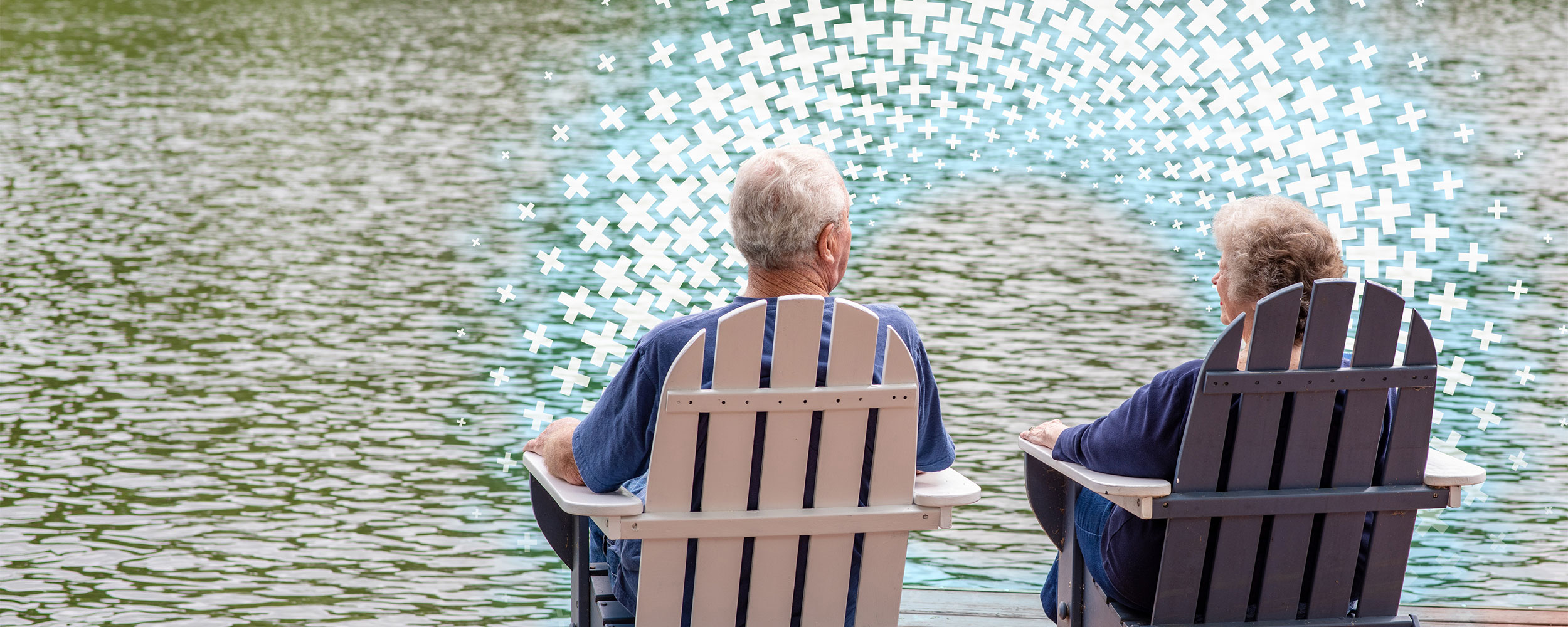 Two seniors sit in Two Adirondack chairs