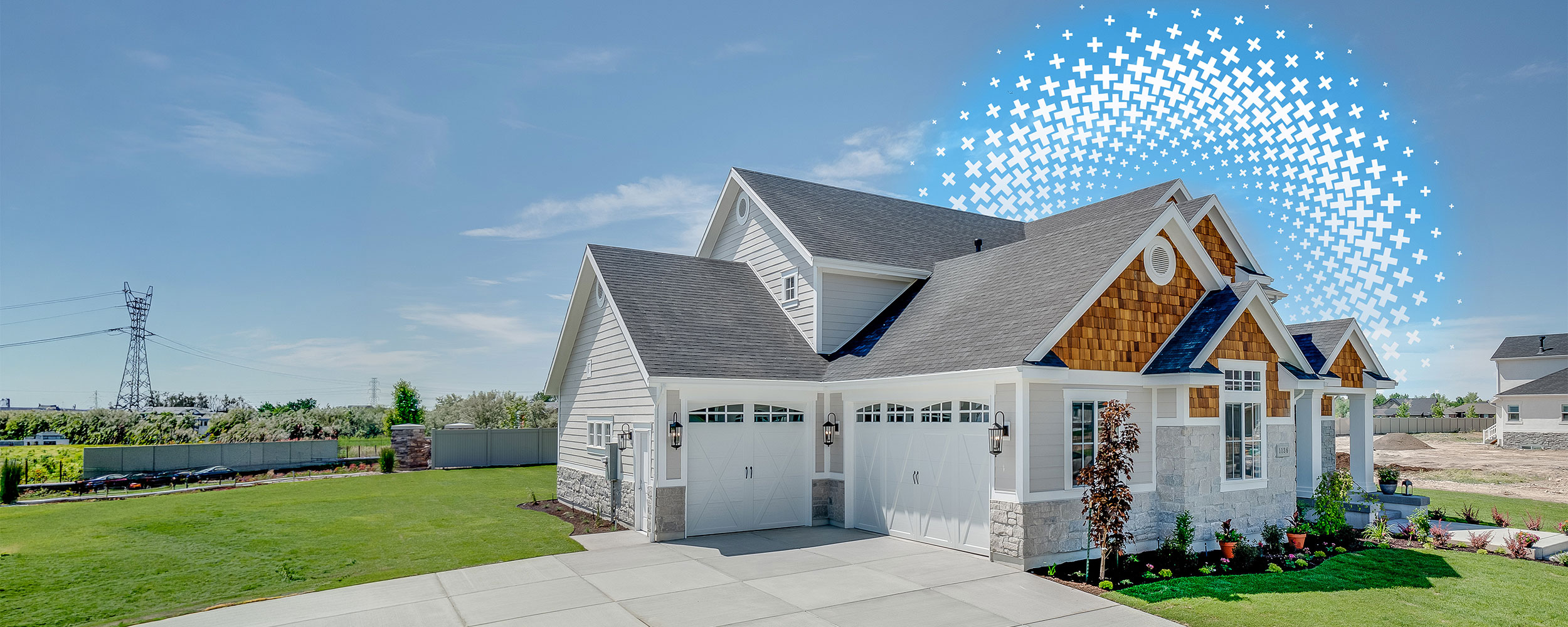 Modern suburban home with a large driveway, attached garage, and landscaped yard.