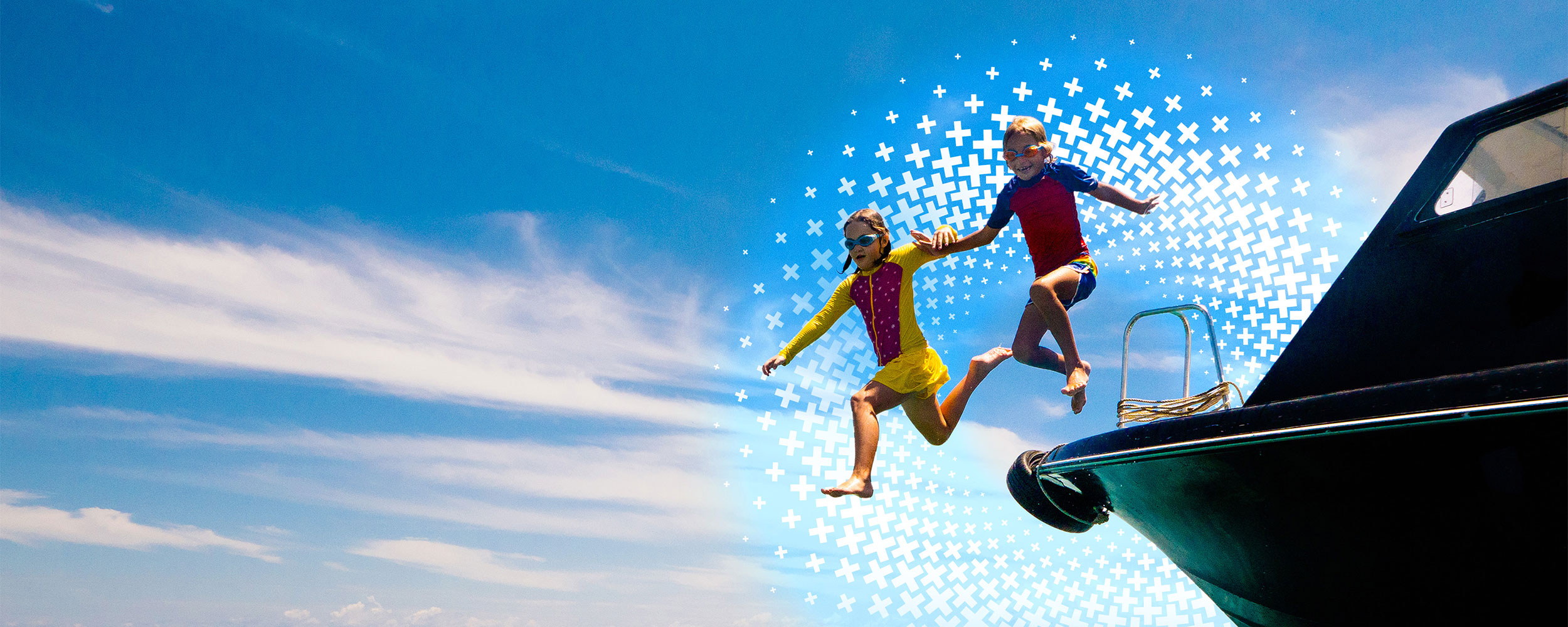 Two kids jumping off a boat, hand-in-hand.