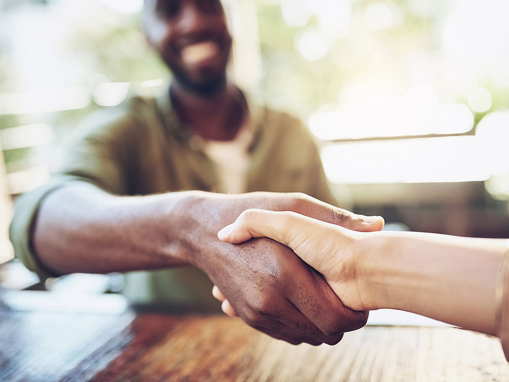 Two people shaking hands.