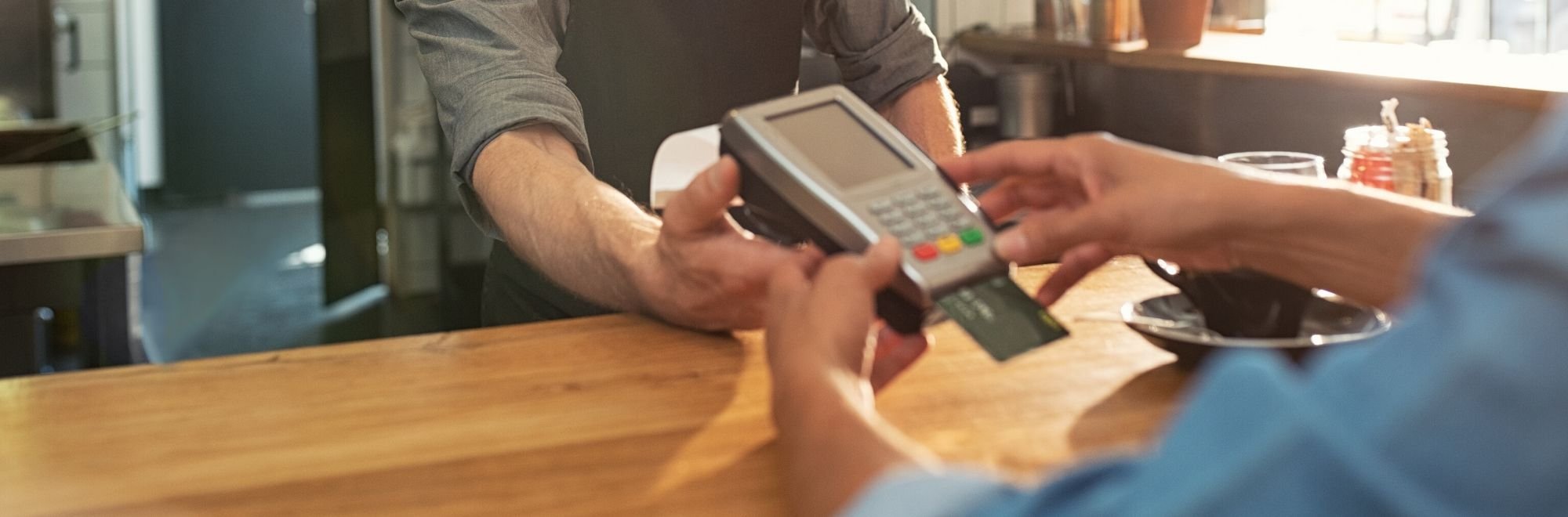 Customer using their business credit card to shop at a local business.